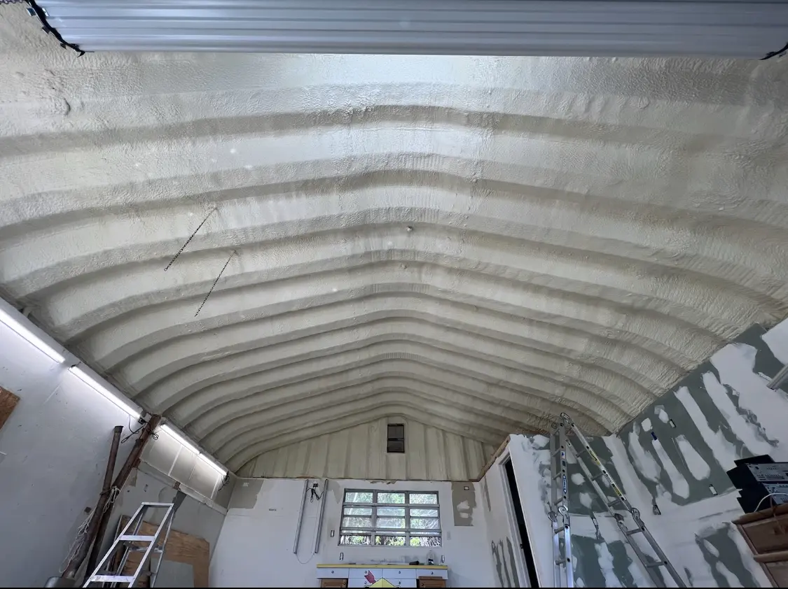 Spray polyurethane foam applied to the underside of a metal roof deck in Newcastle